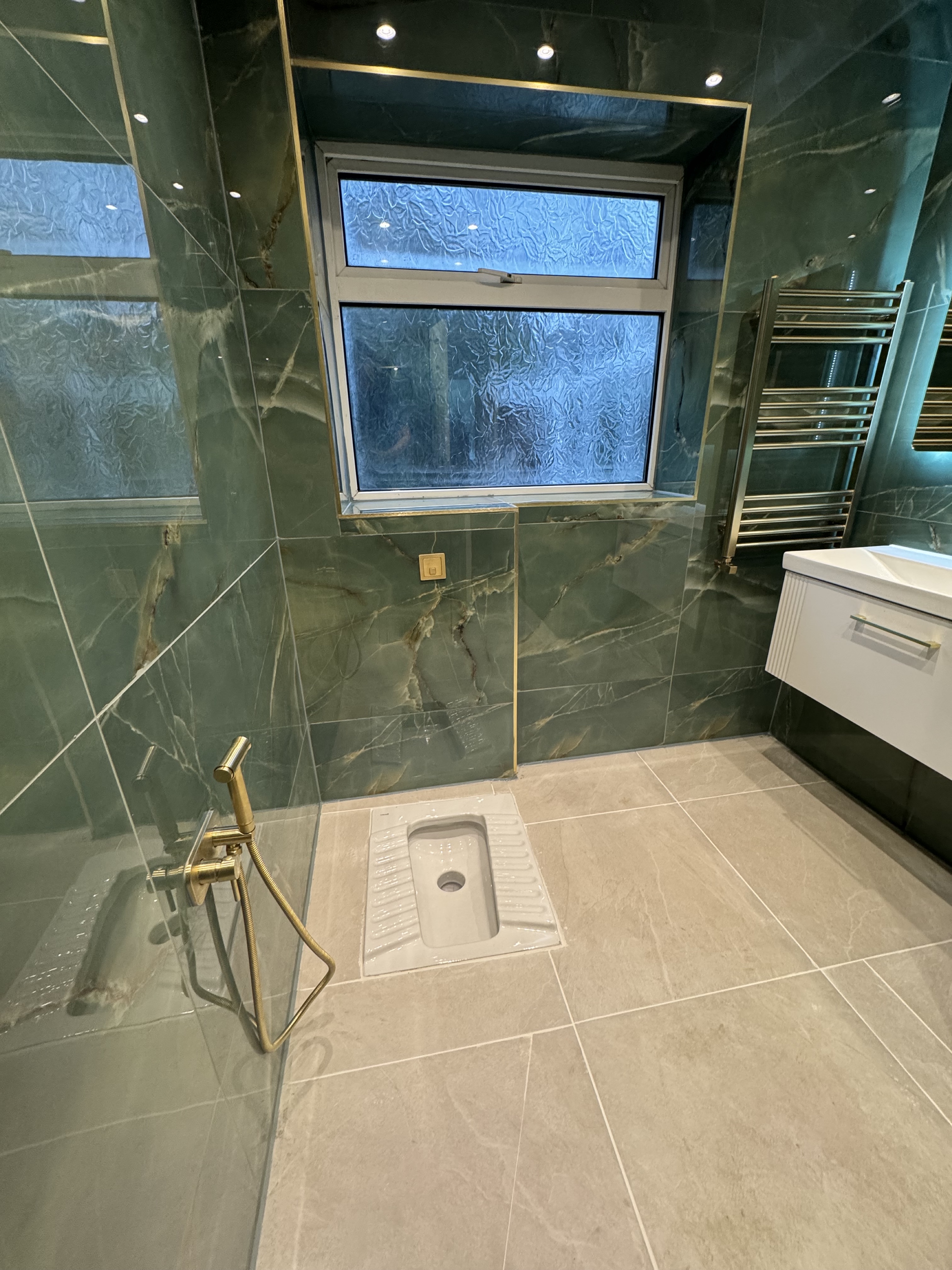 After green marble bathroom renovation